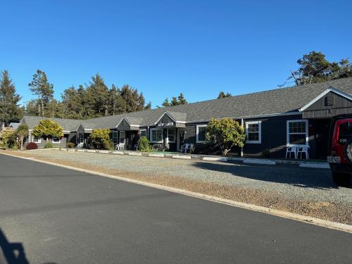 a house with a road in front of it at San Dune Inn in Manzanita