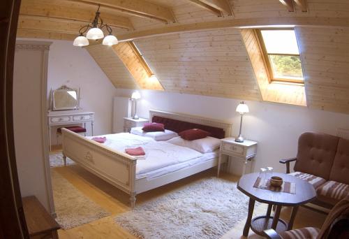 Кровать или кровати в номере Penzion Martinov Dvor