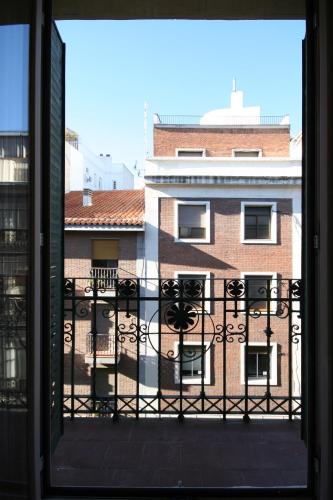 a view of a building from a window at CH Bueno in Madrid