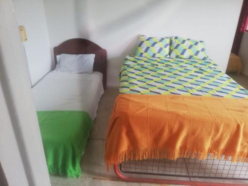 Postel nebo postele na pokoji v ubytování Hotel paraíso del llano
