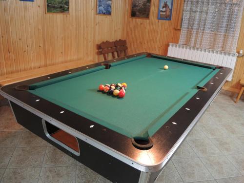 a pool table with a ball on top of it at Pokoje u Tosi i Czesia in Gliczarów