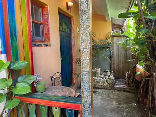a mirror in front of a room with a colorful door at Miami Bungalow Oasis near Everglades & The Keys in Cutler Bay