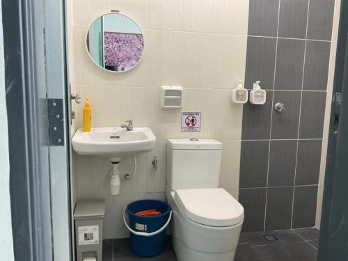 a small bathroom with a toilet and a sink at Az-zahra Home Stay Kulim Hi-Tech in Kulim