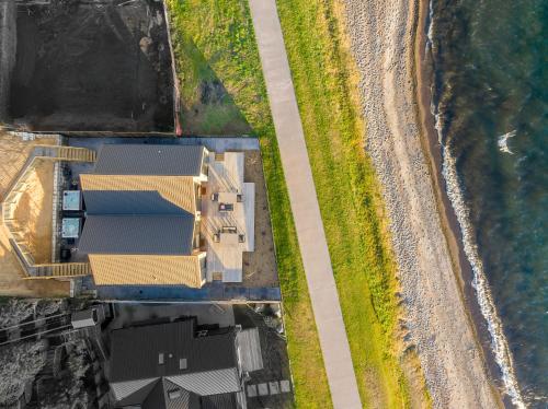 an overhead view of a house next to the beach at Premium Lakefront Unit Spa Pool in Taupo