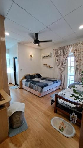 Ένα ή περισσότερα κρεβάτια σε δωμάτιο στο Relax House Raja Uda Butterworth 田园小屋