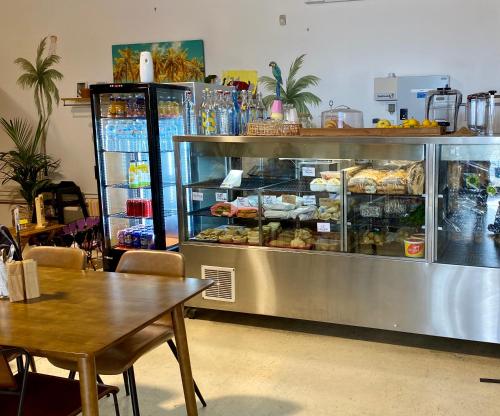a bakery with a display case filled with food at We Love the Bay short stays private suite 1 to 4 days in Saint Leonards