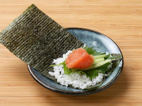 a plate of rice and vegetables on a table at Vessel Hotel Fukuoka Kaizuka in Fukuoka