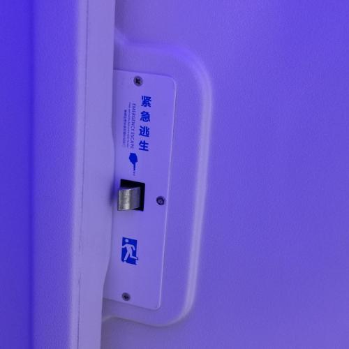 a remote control on a purple wall with at 橙舍太空艙 TW Capsule Hostel in Taipei