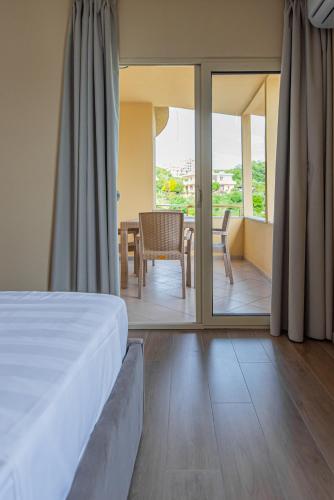 Postel nebo postele na pokoji v ubytování ApartHotel EDA