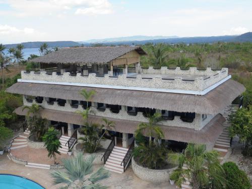 an aerial view of a resort with a swimming pool at The Wild Orchid Resort - Moalboal in Moalboal