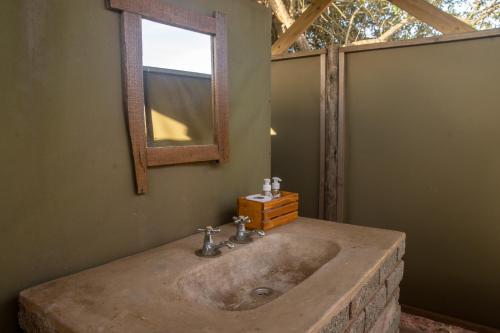 Ванная комната в Hluhluwe Bush Camp Glamping Village