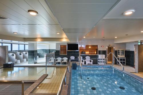 a swimming pool in a hotel room with at Sauna & Capsule Hotel Rumor Plaza in Kyoto