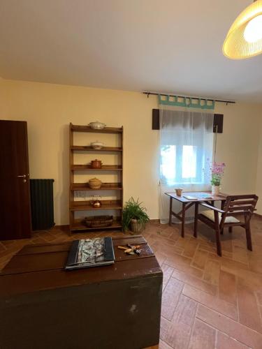 a living room with a table and a dining room at Villa Maria Caterina in Paterno