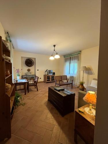 a living room with a couch and a table at Villa Maria Caterina in Paterno
