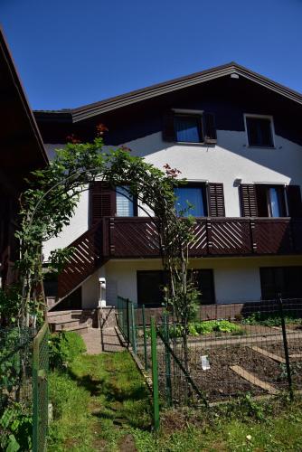 a house with a fence in front of it at Apartment JANG in Tolmin