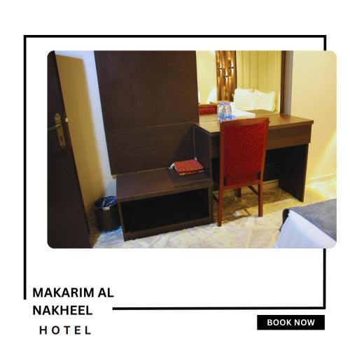 a hotel room with a desk and a red chair at Makarim Palm Hotel in Rabigh
