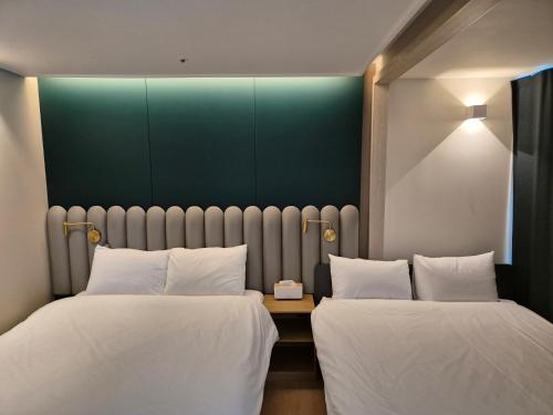 Katil atau katil-katil dalam bilik di The solid residence - Elbon the stay by haeundae