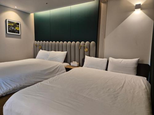 Katil atau katil-katil dalam bilik di The solid residence - Elbon the stay by haeundae