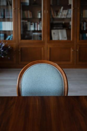 a wooden chair sitting at a table in a room at Villa Covelo in Poio