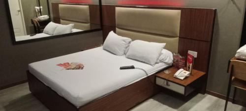 Postel nebo postele na pokoji v ubytování Hotel Sogo Buendia