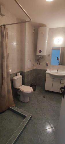 a bathroom being remodeled with a toilet and a sink at Marina in Aheloy