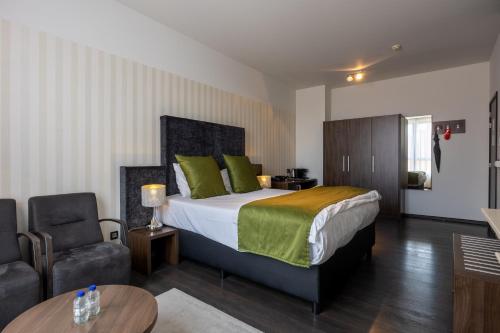 Postel nebo postele na pokoji v ubytování Hotel De Boskar Peer