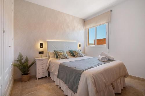 Ένα ή περισσότερα κρεβάτια σε δωμάτιο στο Apartamento Carlos Haya