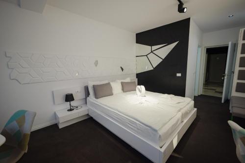 Ένα ή περισσότερα κρεβάτια σε δωμάτιο στο Niro Residence