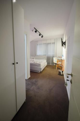 Ένα ή περισσότερα κρεβάτια σε δωμάτιο στο Niro Residence