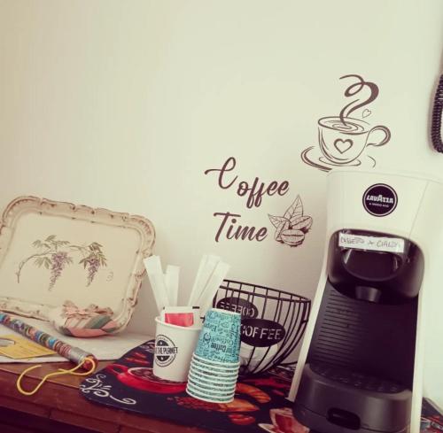 a counter with a coffee time sign on a wall at Il Giramondo in Montelabbate