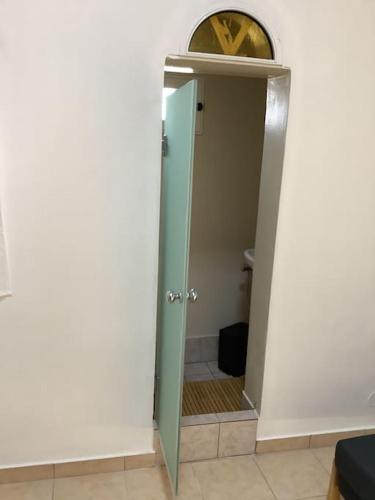 an open door to a bathroom with a toilet at Lemon tree in Filiatra