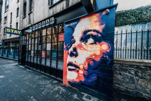 a building with a mural on the side of it at Stay Central Hotel in Edinburgh