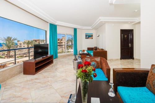 a living room with a view of the ocean at Seagull Beach Resort - Families and Couples Only in Hurghada