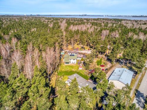 an aerial view of a house in a forest at Luxury house in nature in Yarvekyulya