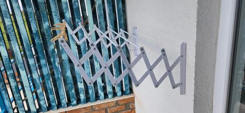 a metal fence next to a building at Casa Mavi in Vama Veche