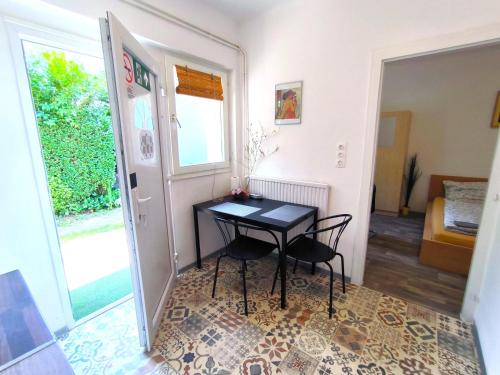 a small room with a table and two chairs at Caesar Residence in Budapest