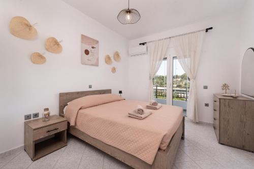 Postel nebo postele na pokoji v ubytování Afandou Panorama Apartment