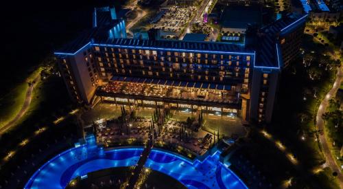 an overhead view of a hotel at night at Concorde Luxury Resort & Casino in Vokolidha