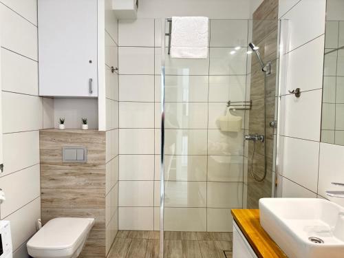 Koupelna v ubytování Apartament NA WYDMIE Gardenia Dziwnów z widokiem na morze EPapartamenty