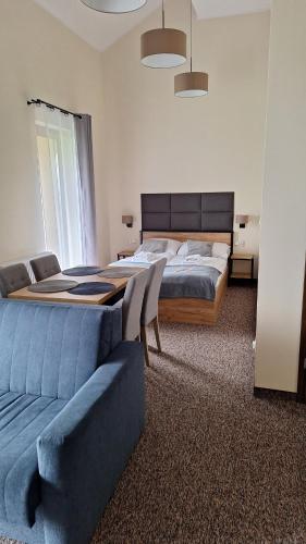 Un pat sau paturi într-o cameră la Skalnica