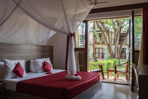Postel nebo postele na pokoji v ubytování My Blue Hotel Zanzibar