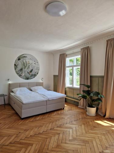 a bedroom with a bed and a large window at Loftfeeling, Parkplatz, WLAN, Diak, Würth in Schwäbisch Hall
