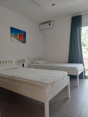 Кровать или кровати в номере Nella