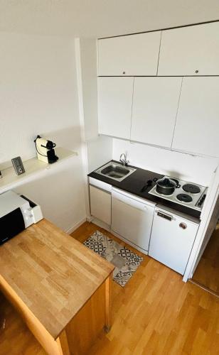 Η κουζίνα ή μικρή κουζίνα στο Cosy ski in/out apartment
