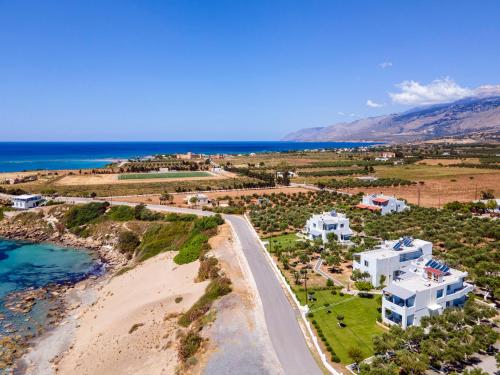an aerial view of a beach and buildings at Paradisos in Frangokastello