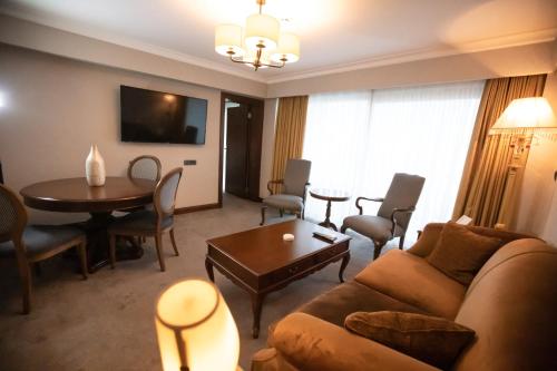 a living room with a couch and a table at La Quinta by Wyndham Giresun in Giresun