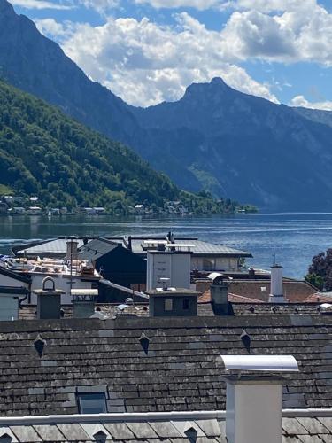 a view of a body of water with mountains at CityLake G23 Apartments in Gmunden