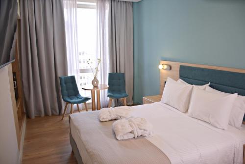 Letto o letti in una camera di Arethusa Hotel Athens