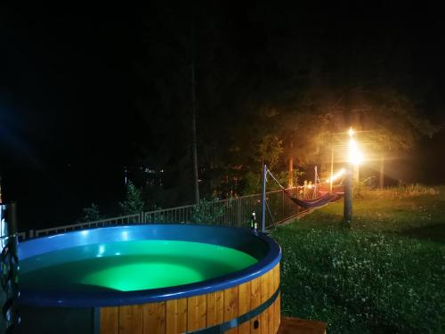 a hot tub in the yard at night at Villa Golful Verde in Colibiţa