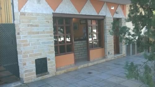 an outside view of a building with glass doors at Apart Ma & Cris in Termas de Río Hondo